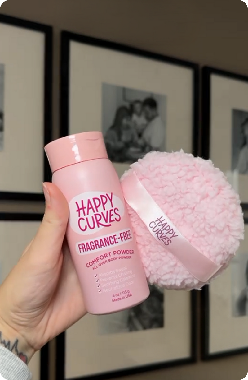 Customer holding Happy Curves Fragrance-Free Comfort Powder and puff